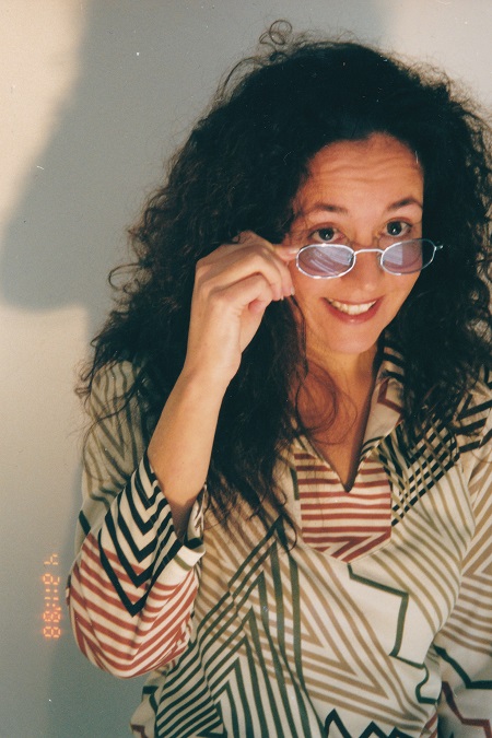 front on shot of Terri holding sunglasses in her hand