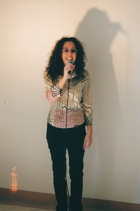 full height shot front on singing