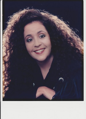  a picture of Terri from her sholders up smiling